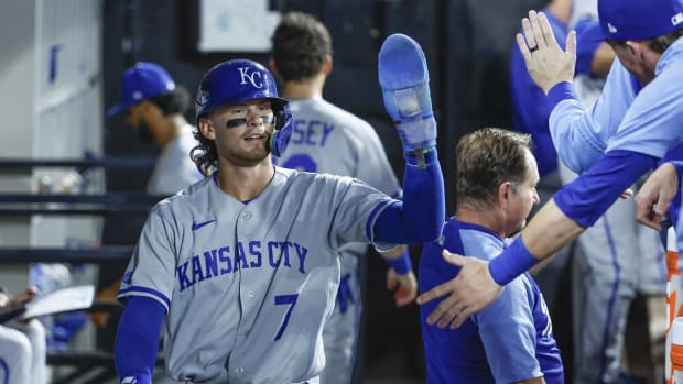 Aug 30, 2022; Chicago, Illinois, USA; Kansas City Royals shortstop Bobby Witt Jr. (7) celebrates with teammates after scoring against the Chicago White Sox during the fifth inning at Guaranteed Rate Field. Mandatory Credit: Kamil Krzaczynski-USA TODAY Sports